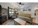 Bright living area with a decorative fireplace, plush sofa, and mountain-themed accents at 324 County Road 672, Breckenridge, CO 80424