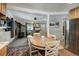 Open concept kitchen and living room area with stone fireplace at 324 County Road 672, Breckenridge, CO 80424