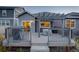 Back deck featuring a pergola, grill, and a table with views of the backyard at 6905 Fraser Cir, Frederick, CO 80530