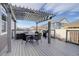 A covered wooden deck provides ample space for outdoor entertainment at 6905 Fraser Cir, Frederick, CO 80530