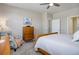 Bedroom features natural light, a ceiling fan, and a comfortable chair at 6905 Fraser Cir, Frederick, CO 80530