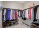 Walk-in closet with ample hanging space for clothes and shelving for shoes at 6905 Fraser Cir, Frederick, CO 80530