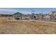 Community playground featuring a play structure, picnic tables, and mountain views at 6905 Fraser Cir, Frederick, CO 80530