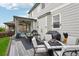 Backyard patio featuring an outdoor dining area, grilling area, and a comfortable lounge space at 6520 Empire Ave, Frederick, CO 80516