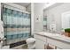 Bathroom featuring a vanity with granite countertop, a decorative shower curtain and tile flooring at 6520 Empire Ave, Frederick, CO 80516