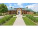 Attractive single story clubhouse building featuring a green roof and meticulous landscaping at 6520 Empire Ave, Frederick, CO 80516