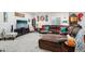 Large living room featuring a brown sectional, TV, and decorated walls at 6520 Empire Ave, Frederick, CO 80516