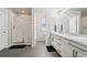 Bathroom featuring double sinks, a walk in shower and tile floors at 6520 Empire Ave, Frederick, CO 80516