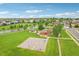Aerial view of the neighborhood park with a playground, basketball court, and open green space at 6520 Empire Ave, Frederick, CO 80516