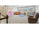 Spacious playroom featuring neutral walls, carpet, and many recreational items at 6520 Empire Ave, Frederick, CO 80516
