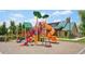 A colorful playground offers fun for all with slides and climbing structures at 6520 Empire Ave, Frederick, CO 80516