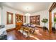 Dining area with hardwood floors, a cowhide rug, and a built-in wooden cabinet at 1440 Saint Paul St, Denver, CO 80206