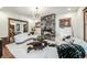 Bright living room featuring a modern fireplace, curved sofas, and contemporary lighting at 1440 Saint Paul St, Denver, CO 80206