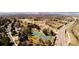 Aerial view showcases the property's proximity to local amenities, like tennis courts, parks, and roadways at 8210 W 72Nd Pl, Arvada, CO 80005