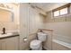 Half bath with a sink and toilet features a built in storage cabinet for functionality and convenience at 8210 W 72Nd Pl, Arvada, CO 80005