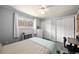 Relaxing bedroom featuring lots of natural light, soft colors, and closet space at 8210 W 72Nd Pl, Arvada, CO 80005