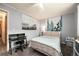 Cozy bedroom with natural light, a ceiling fan, and charming decor elements at 8210 W 72Nd Pl, Arvada, CO 80005