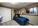 Cozy bedroom with a stylish sun tapestry on the wall and an inviting ambiance at 8210 W 72Nd Pl, Arvada, CO 80005