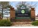 The Indian Tree Golf Club sign with well-maintained landscaping is located by the clubhouse and restaurant at 8210 W 72Nd Pl, Arvada, CO 80005