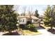 Charming home featuring mature trees and a well-manicured front lawn for great curb appeal at 8210 W 72Nd Pl, Arvada, CO 80005