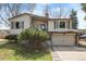 Charming home with a well-maintained front yard and attached two-car garage at 8210 W 72Nd Pl, Arvada, CO 80005
