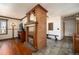 Stylish living room with a fireplace and tile flooring flowing into a connected hallway at 8210 W 72Nd Pl, Arvada, CO 80005