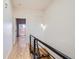 Upper hallway with hardwood floors and access to bedrooms at 2345 Walnut St # 24, Denver, CO 80205