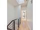 Light-filled hallway with hardwood floors and city views at 2345 Walnut St # 24, Denver, CO 80205