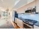 Sleek kitchen with stainless steel appliances and granite countertops at 2345 Walnut St # 24, Denver, CO 80205