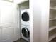 Convenient laundry closet with stackable washer and dryer at 2345 Walnut St # 24, Denver, CO 80205