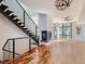 Spacious living room featuring hardwood floors, fireplace, and large windows at 2345 Walnut St # 24, Denver, CO 80205