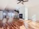 Sunlit living room with hardwood floors and modern fireplace at 2345 Walnut St # 24, Denver, CO 80205