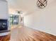 Open living area with hardwood floors and fireplace at 2345 Walnut St # 24, Denver, CO 80205