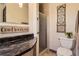 Updated bathroom with modern vanity and walk-in shower at 10247 W Arkansas Ave, Lakewood, CO 80232
