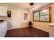 Dining area with a large window, pendant lighting, and access to the kitchen at 10247 W Arkansas Ave, Lakewood, CO 80232