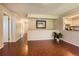 Open living space with patterned flooring and a view into the kitchen at 10247 W Arkansas Ave, Lakewood, CO 80232