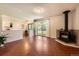 Spacious living room featuring a fireplace, sliding glass doors, and unique flooring at 10247 W Arkansas Ave, Lakewood, CO 80232