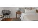 Bedroom featuring hardwood floors, a comfortable bed, stylish decor and a bedside table at 15612 E 96Th Way # 9B, Commerce City, CO 80022