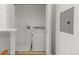 Bright and spacious laundry room with washer and dryer and built in shelves at 15612 E 96Th Way # 9B, Commerce City, CO 80022