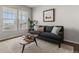 Bright living room with large windows, plush rug, and modern decor creating a comfortable ambiance at 15612 E 96Th Way # 9B, Commerce City, CO 80022