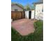 Backyard patio with red stone, green lawn, a fence, and access to a shed at 2617 S Cimarron St, Aurora, CO 80014