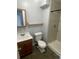 Neutral bathroom with a single sink, shower stall, and new tiling and fixtures throughout at 2617 S Cimarron St, Aurora, CO 80014