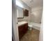 Bathroom featuring tile flooring, dark wooden vanity, light countertops, a toilet and shower/tub combo at 2617 S Cimarron St, Aurora, CO 80014