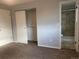 Bedroom with private updated bath, closet, and neutral color palette at 2617 S Cimarron St, Aurora, CO 80014