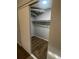 An organized closet with sliding doors and built-in shelving perfect for storage at 2617 S Cimarron St, Aurora, CO 80014