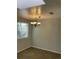 A dining room featuring a chandelier and a window with blinds at 2617 S Cimarron St, Aurora, CO 80014