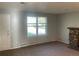Bright living room with a stone fireplace and a large window at 2617 S Cimarron St, Aurora, CO 80014