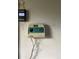 Sprinkler system controller in garage with zones noted for convenience at 2617 S Cimarron St, Aurora, CO 80014