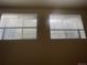 Two windows provide natural light at 2617 S Cimarron St, Aurora, CO 80014