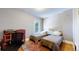 Bedroom featuring two twin beds, hardwood floors, and a comfortable atmosphere at 2227 N Ogden St, Denver, CO 80205